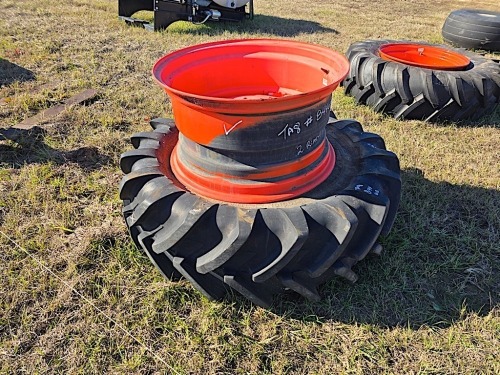 (2) Kubota Tractor Rims and (1) 16.9R28 Tractor Tire