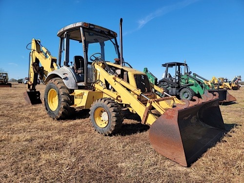 New Holland 555E 4WD Extendahoe, s/n 031001904: 9070 hrs