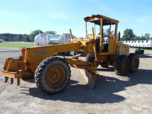 John Deere 570A Motor Grader, s/n 507477: Canopy, 12' Moldboard, Front Scarifier, 13.00-24 Tires