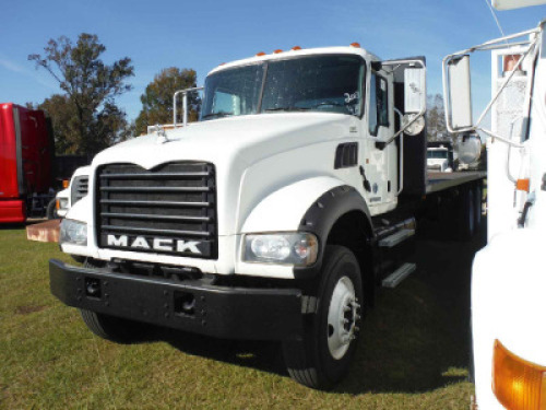 2013 Mack Granite GU433 Flatbed Truck, s/n 1M2AX32C6DM010129: T/A, Cummins 345hp Eng., Eaton Fuller 8-sp., Air Ride, 12K Front, 40K Rears, Rogers 24.5 Steel Flatbed, Odometer Shows 275K mi.