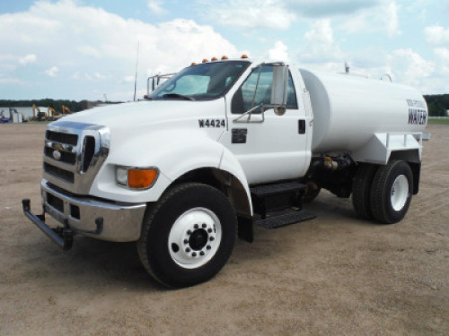 2006 Ford F750 Water Truck, s/n 3FRXF75E06V384424: S/A, Cummins 5.9L Eng., 6-sp., 12K Front, 21K Rear, 2000-gal Tank, Front & Rear Spray Nozzles, Odometer Shows 16K mi.